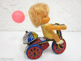 Vintage Mid Century Wind-Up Toy, Blond Girl Riding a Tricycle with Pink Balloon