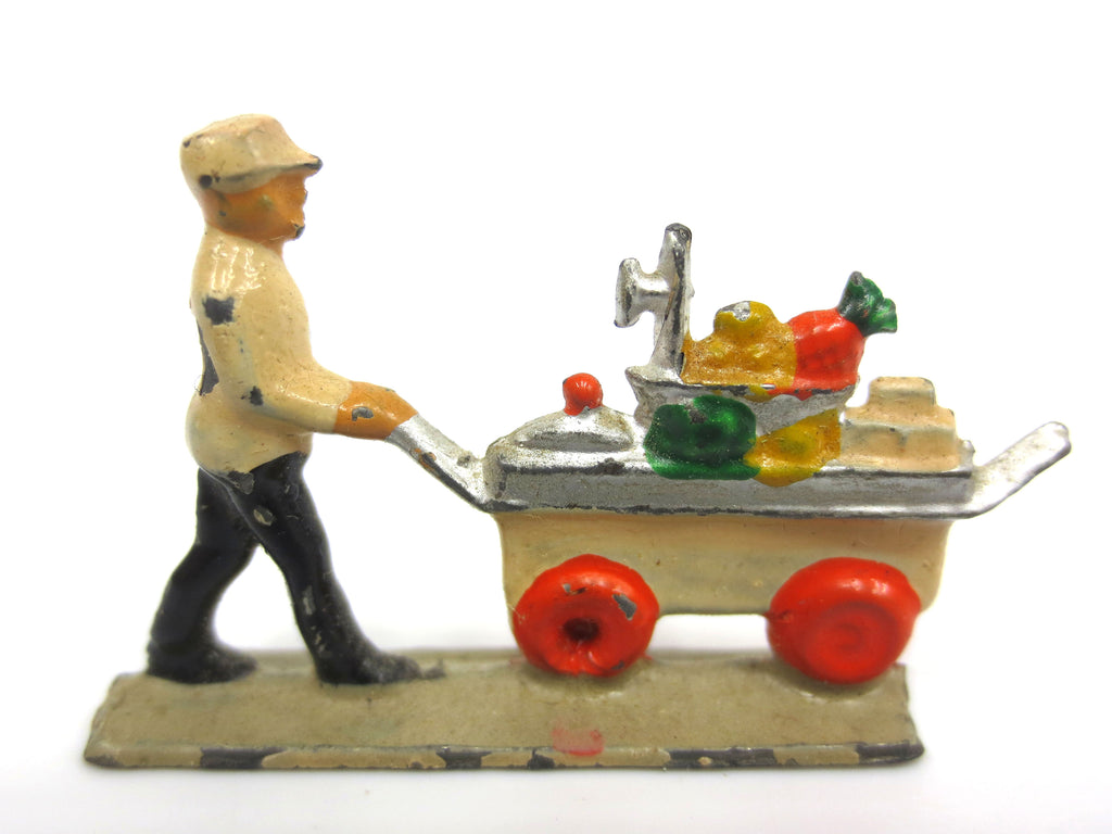 Vintage Miniature Lead Figurine, Caterer in Uniform Pushing Cart Fruits Desserts