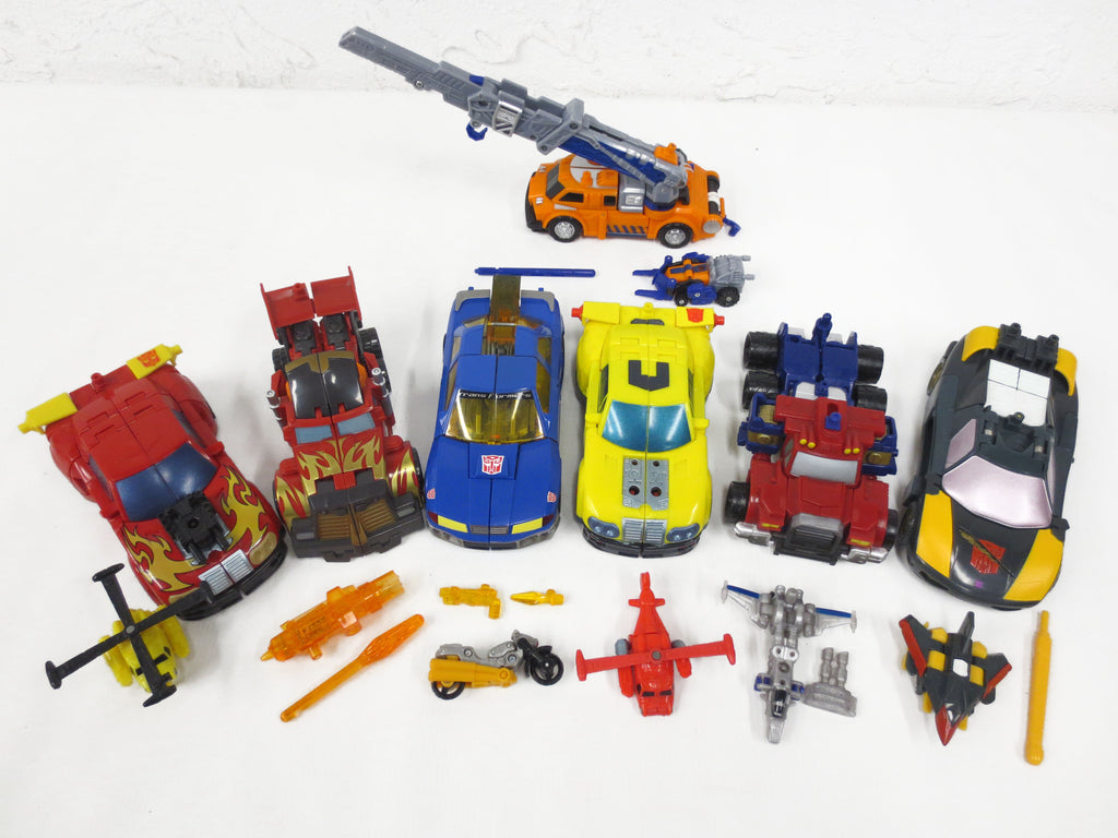 Lot of 7 Transformers Robots with their 7 Original Autobots Signed Takara 2002 2003 2004 Cars Trucks Crane